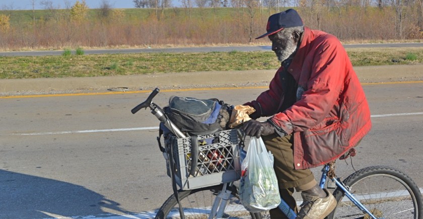 Man with fresh collard greens, Cairo, IL