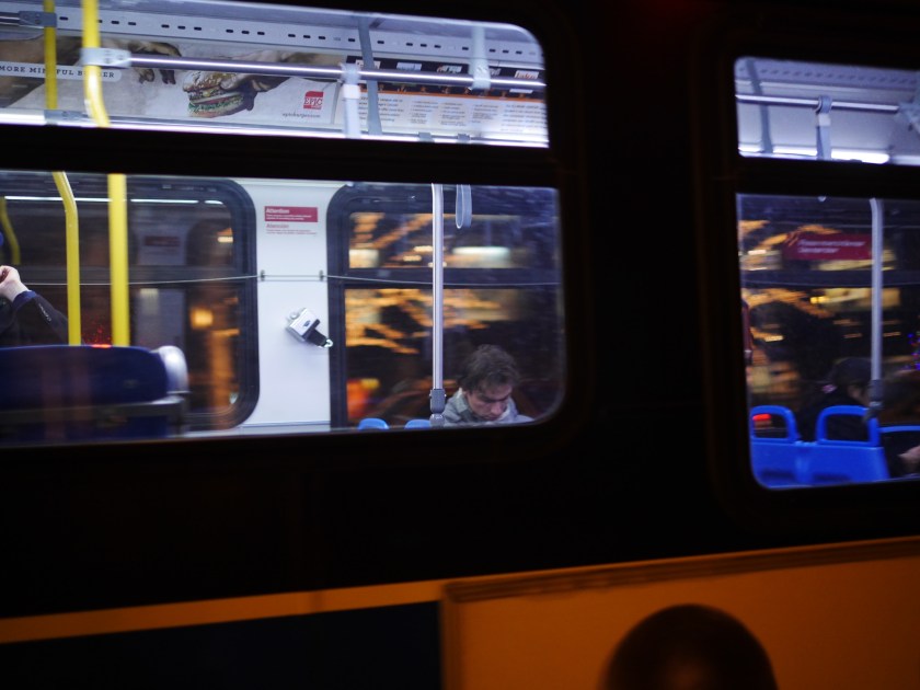 other man sleeping on bus